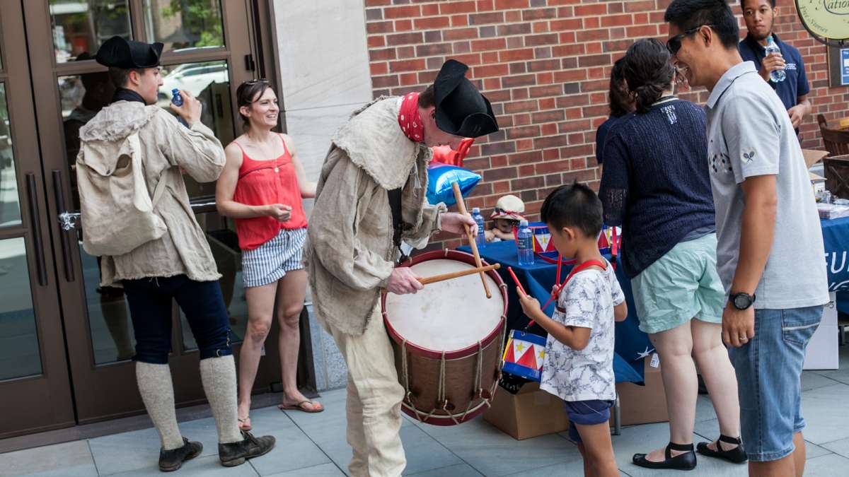 Drummer Keith Henning shows off his replica drum made from the same materials as the drums used during the Revolutionary War. (Brad Larrison for NewsWorks)