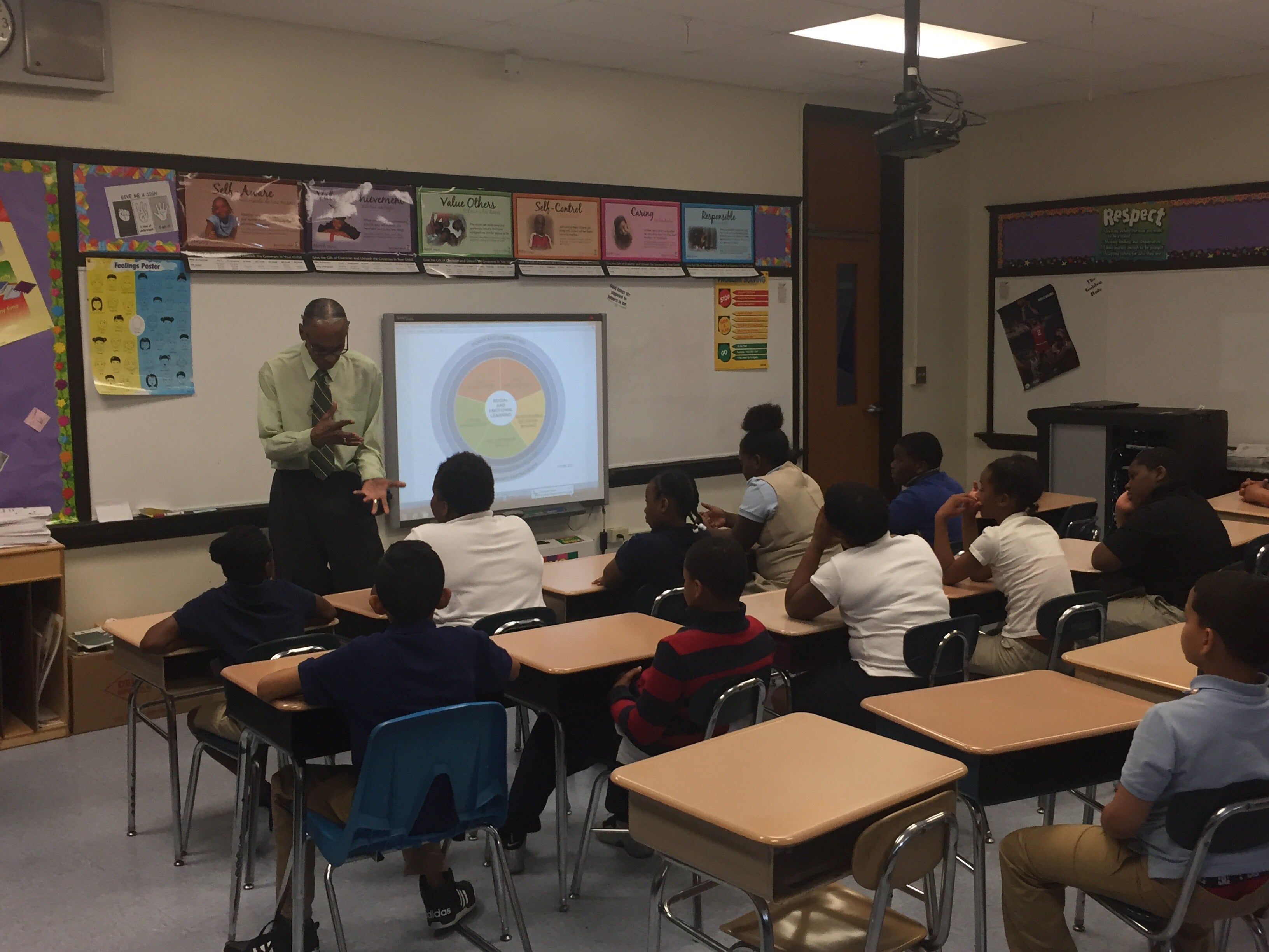  Harold Pritchett teaches his class in social and emotional learning at Warner Elementary School. Warner is one of six high-poverty schools in Wilmington that are struggling to improve after being targeted for possible closure in 2014 by then-Gov. Jack Markell. (Cris Barrish/WHYY) 