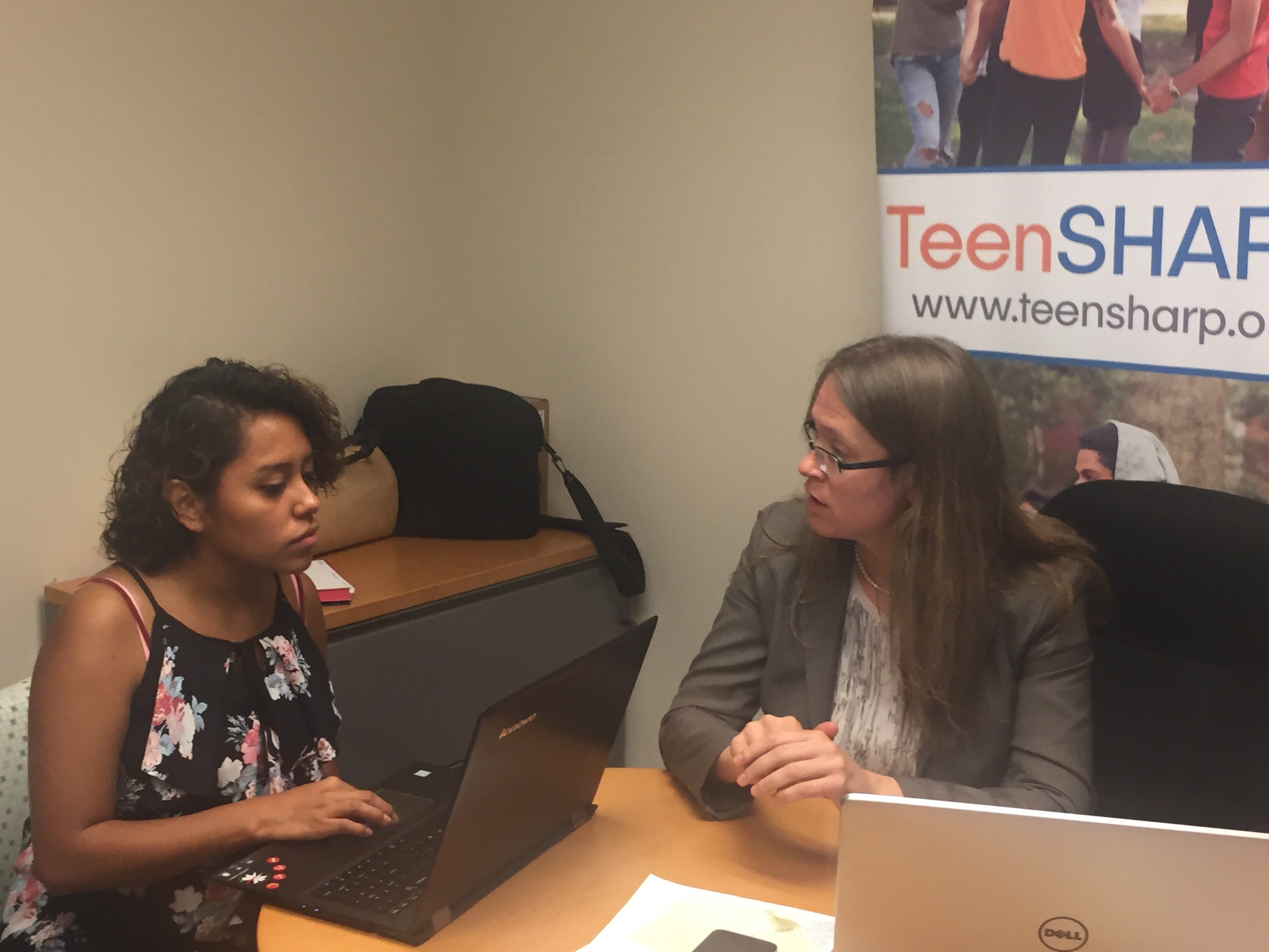  Alejandra Villamares (keft), shown with TeenSHARP director Tatiana Poladko, has earned a full scholarship to Wesleyan University with the agency's assistance. (Cris Barrish/WHYY) 