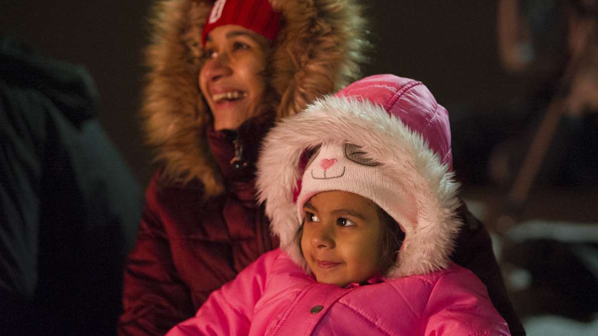 Yamini Varshney and her daughter Manushree Bahree enjoy the finale of the midnight display of the New Year's fireworks at Penn's Landing.