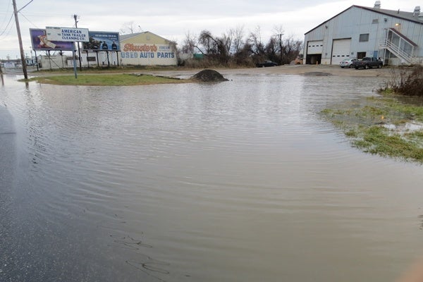 <p><p>High water blocks the entrance to this business on S. Market St. in Wilmington. (Mark Eichmann/WHYY)</p></p>
