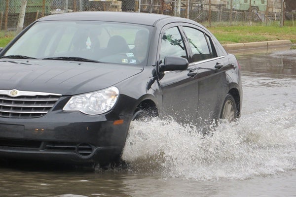 <p><p>High water slowed but didn't stop this driver heading into Wilmington on 12th Street. (Mark Eichmann/WHYY)</p></p>
