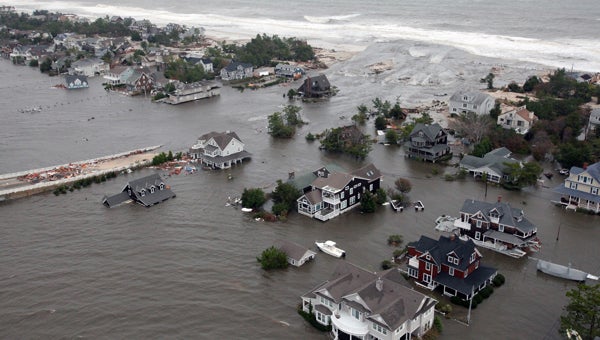  This Oct. 30, 2012 aerial photo provided by the U.S.Air Force shows flooding on the New Jersey shoreline during a search and rescue mission. (AP Photo/U.S. Air Force, Master Sgt. Mark C. Olsen) 
