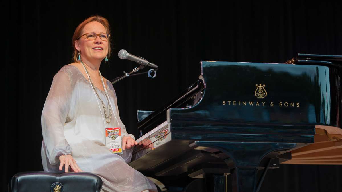 Friday night headliner Iris DeMent chats with the audience during her set.