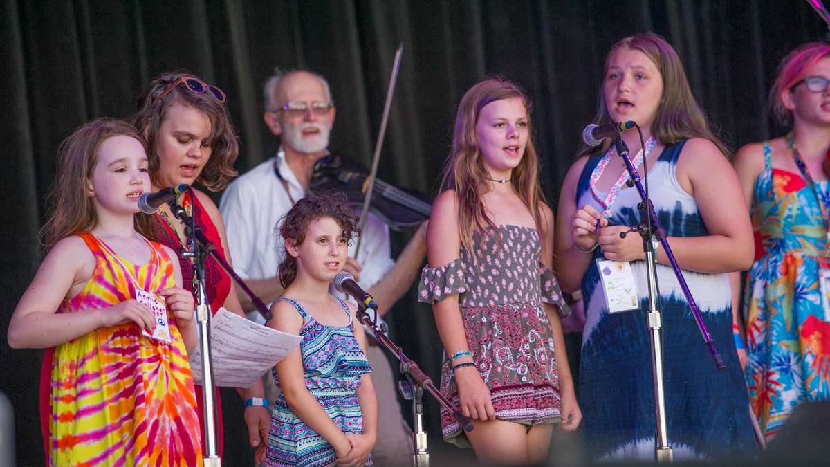 The Great Groove Band were the first performers of the Sunday evening concert on the Martin Guitar Stage. The band features children aged 6 to 17 who sing and play folk instruments. (Jonathan Wilson for NewsWorks)
