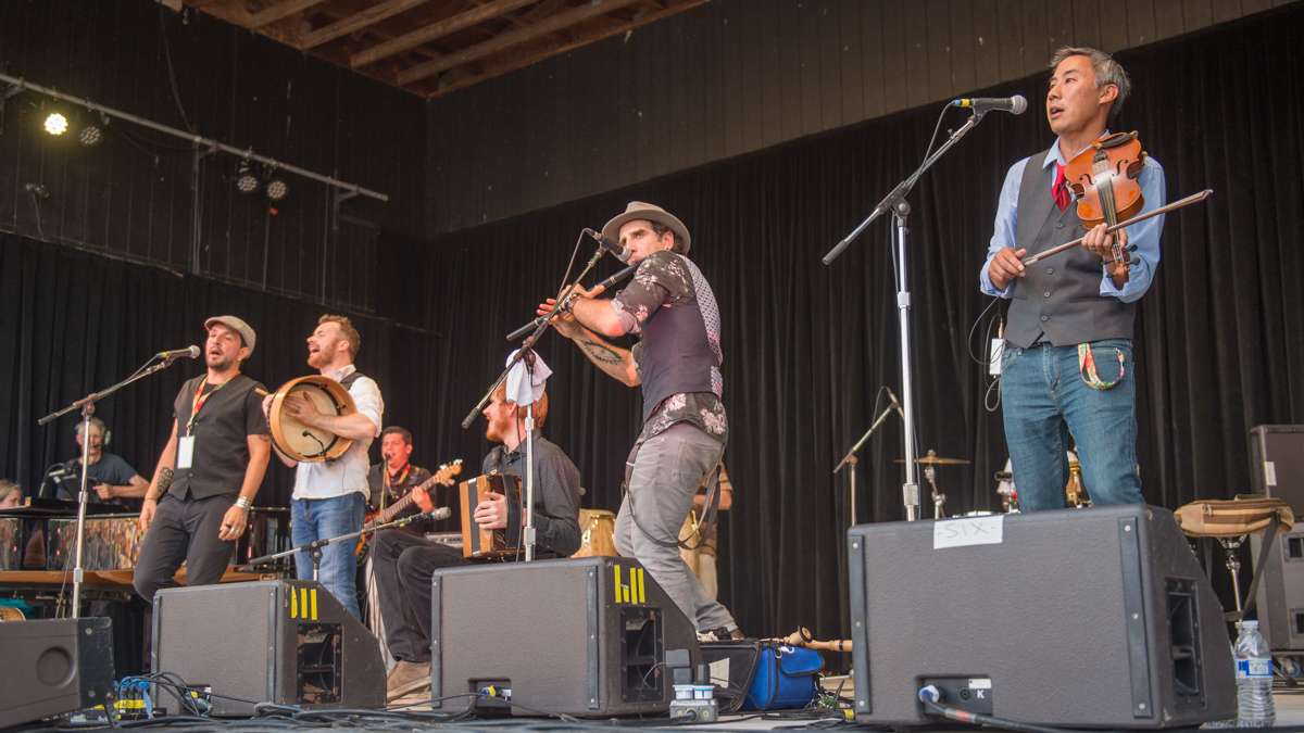 The Irish-Latin fusion band Baile An Salsa performs during the Sunday evening concert on the Martin Guitar Stage. (Jonathan Wilson for NewsWorks)