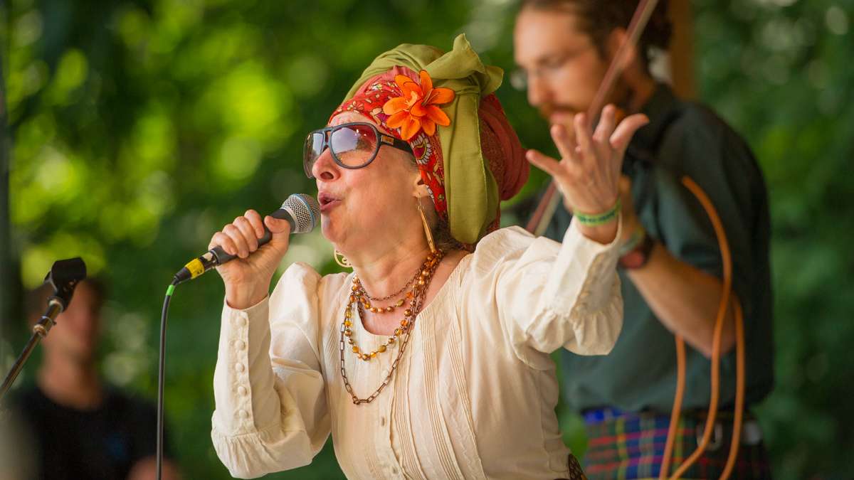 Janet Bressler, the lead singer of Sylvia Platypus, gives a Sunday afternoon performance on the Camp Stage. (Jonathan Wilson for NewsWorks)