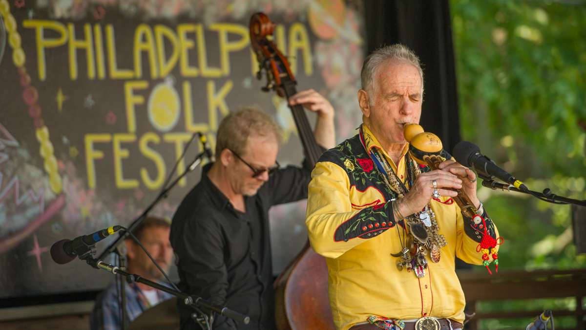 Global folk musician David Amram performs with friends on the festival's Tank Stage. (Jonathan Wilson for NewsWorks)