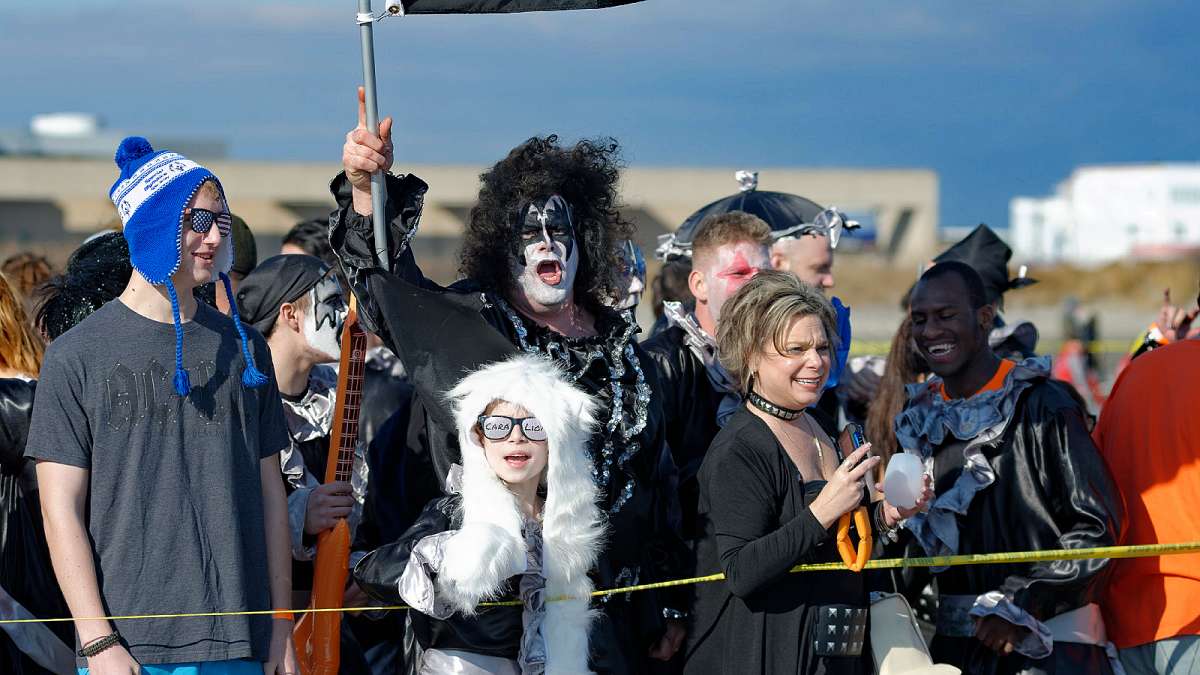 Scott Rambo (middle), of the PiggyPark Plungers in his Gene Simmons outfit. (Bastiaan Slabbers/for NewsWorks)