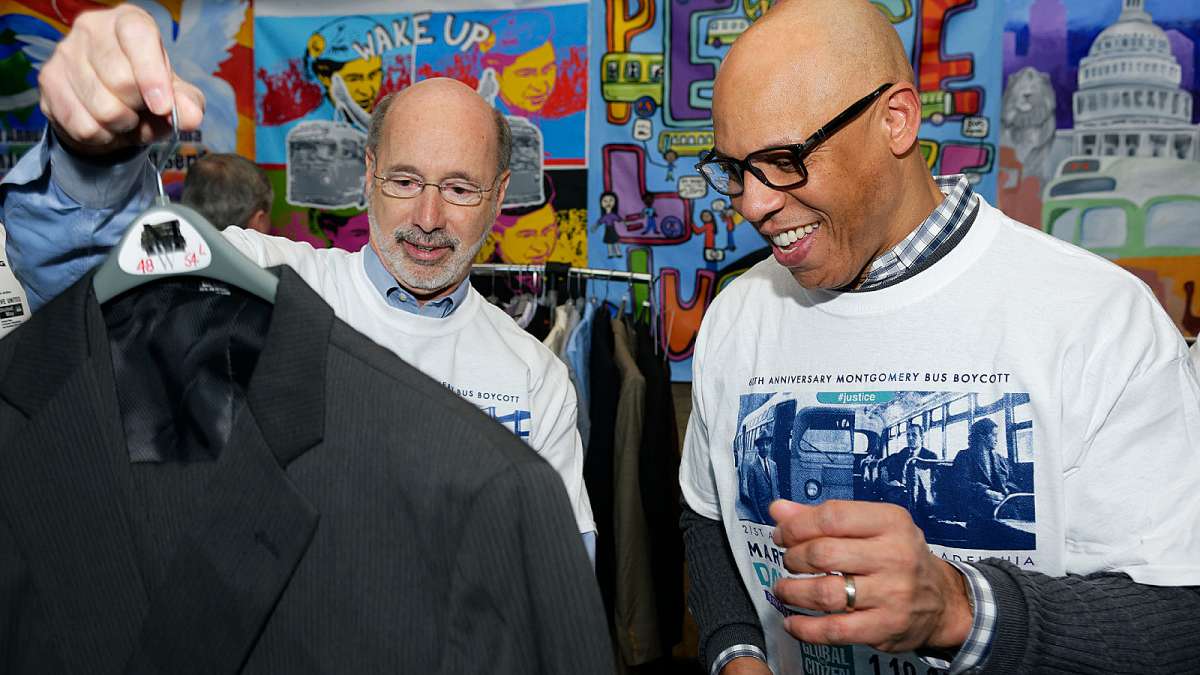Pa. Gov. Tom Wolf (left) and Philadelphia schools Superintendent William Hite check out a donated jacket. (Bastiaan Slabbers/for NewsWorks)