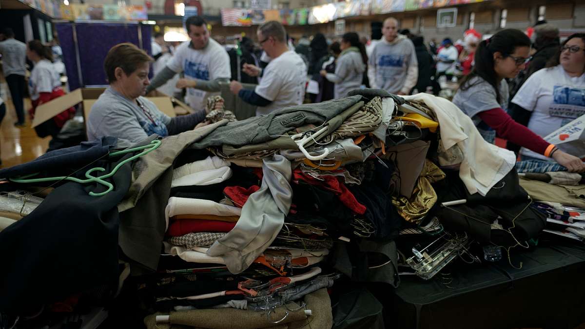 Gently used, donated business attire is sorted by volunteers to be re-distributed to job-seekers. (Bastiaan Slabbers/for NewsWorks)