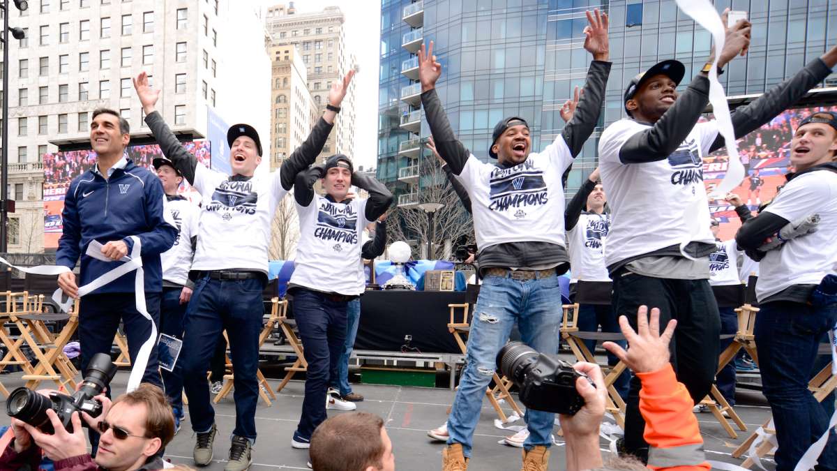 The Wildcats celebrate at Dilworth Plaza.