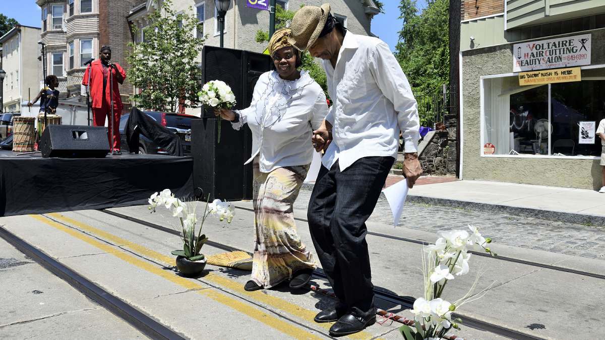Couples jump the broom during the Juneteenth Festival on Germantown Avenue. The jumping of brooms is an African-American tradition that was part of wedding ceremonies of slaves in the South.