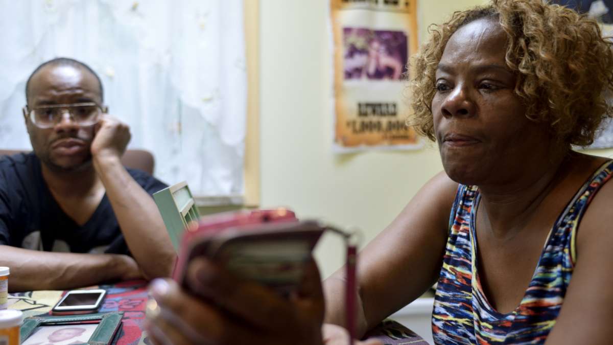 Younger brother Meneek Jones and mother Michelle Witherspoon listen to the last voicemail recording they have of Kenyada Jones.