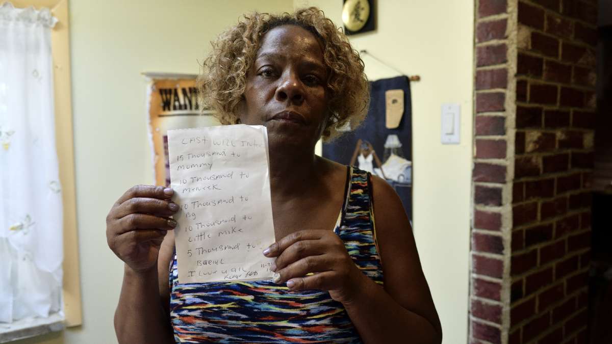 Michell Witherspoon shows a handwritten will made by her son, Kenyada Jones, in 2014.  Jones died at Curran-Fromhold Correctional Facility on July 2. (Bastiaan Slabbers for NewsWorks)