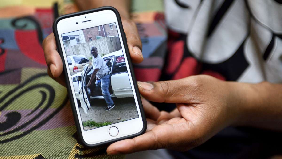 Meneek Jones shows a picture on his phone of his brother.