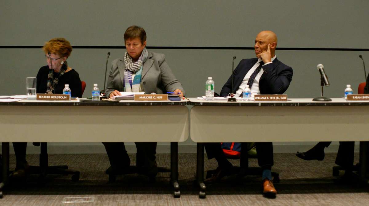 Members of SRC listen to a speaker.