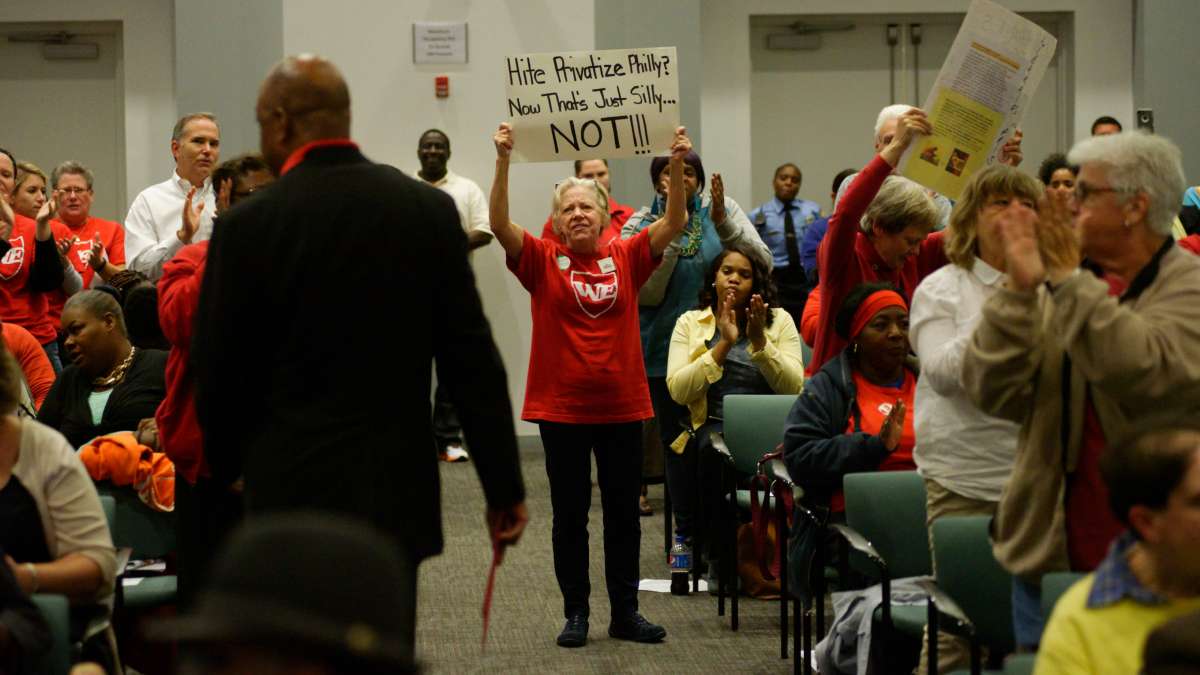 Supporters stand up as PFT President Jerry Jordan walks back to his seat.