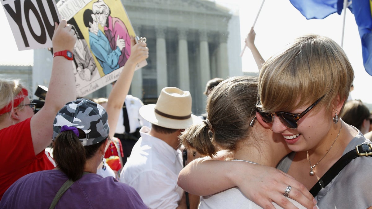  American University students Sharon Burk, left, and Molly Wagner, embrace outside the Supreme Court after Wednesday DOMA ruling.  (AP Photo/Charles Dharapak) 