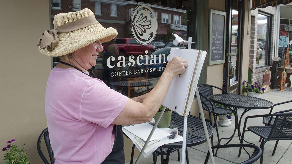 Artist Rita Michalenko paints a street scene during the first annual New Jersey Fringe Festival in Hammonton.