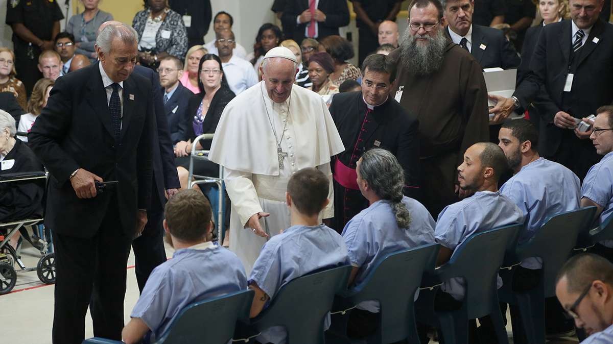 Pope Francis shook the hands of each of the inmates. (Kevin Cook/for NewsWorks)