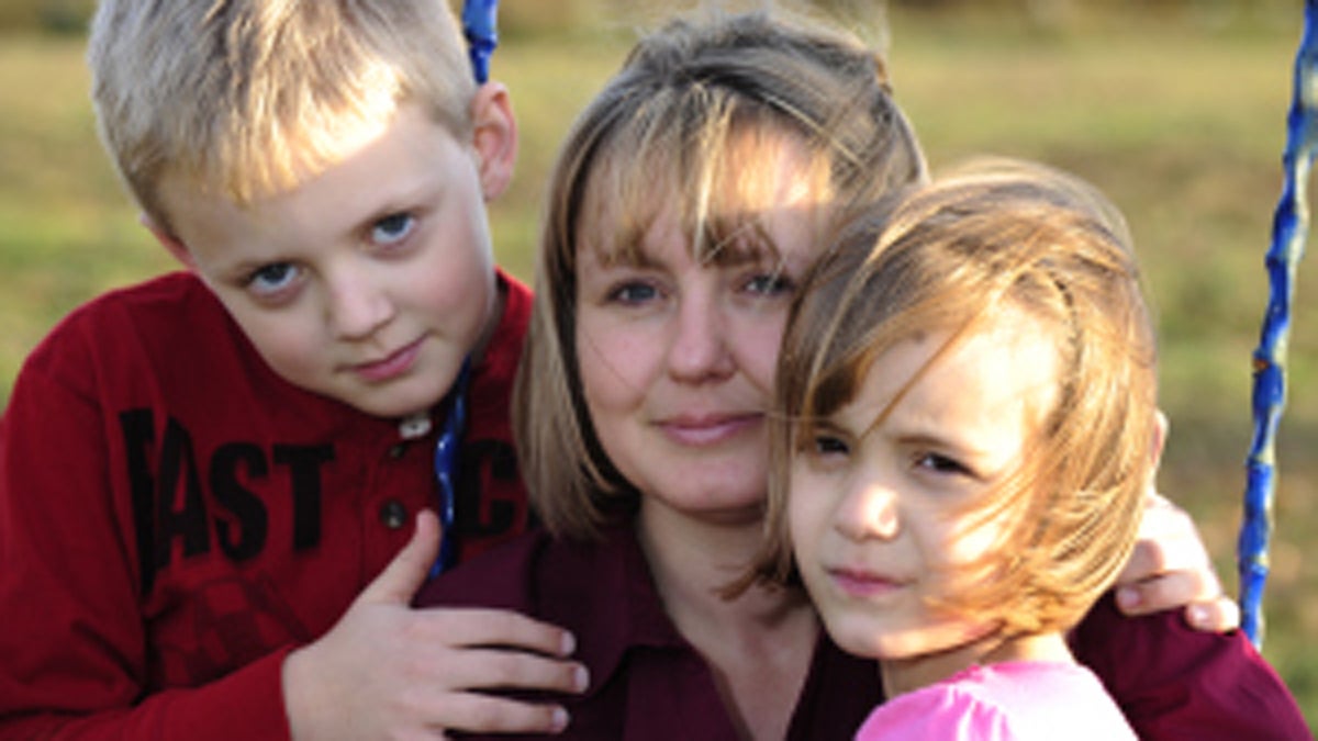  Stephanie Hallowich with her two children, who are banned by a court order from ever discussing fracking or Marcellus Shale drilling. (Photo by Mark Schmerling. Image courtesy of Protecting Our Waters.) 