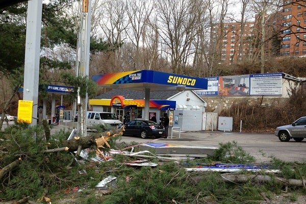 <p><p>Heavy winds knocked a tree down, and through the price sign, at the Sunoco gas station at Wissahickon Ave. and Rittenhouse St. on Thursday morning. (Jane Winters/for NewsWorks)</p></p>
