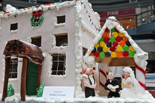 <p>The Gingerbread House Display at the Rotunda features replicas of historic sites of Fairmount Park available to tour during the holiday season. The Water Works gingerbread structure includes a wedding scene. (Kimberly Paynter/for NewsWorks)</p>
