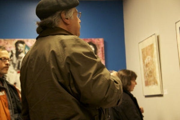 <p><p>Jim Dragoni observed art at the On The Ground exhibit. (Haley Kmetz/for NewsWorks)</p></p>
