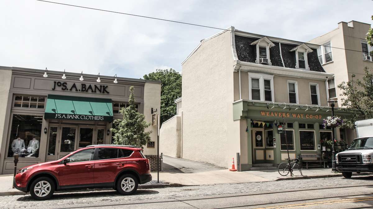 At 8416 Germantown Avenue, Dunmore’s Groceries is now a clothing store and Weavers Way Co-op has taken the place of Caruso’s. (Kimberly Paynter/WHYY)