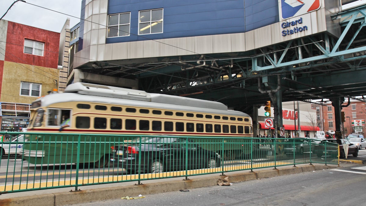  A trolley runs down Girard Street under the Girard Street station of the Market-Frankford Line. (Kimberly Paynter/WHYY) 