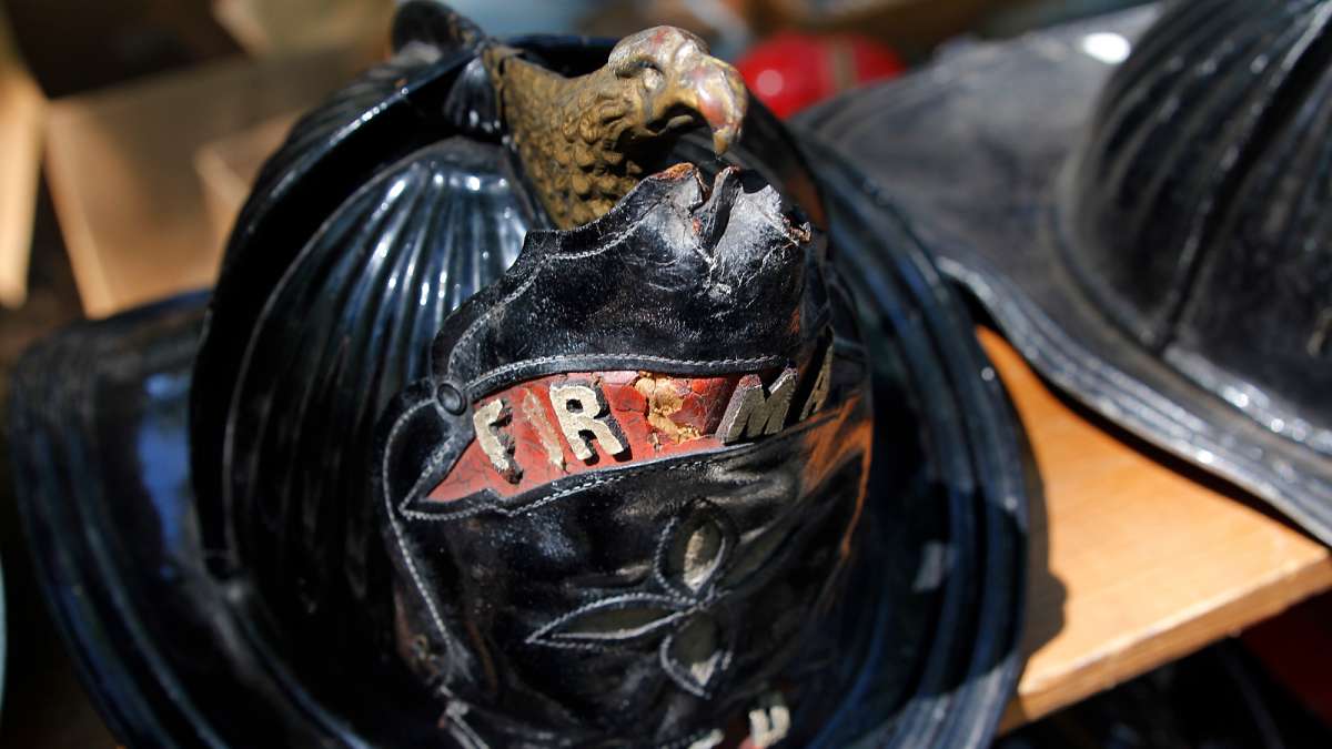 Detail from an antique firefighter's helmet at the 37th Annual Fire Apparatus Show and Muster at WheatonArts, in Millville, NJ, on Sunday. (Jana Shea for NewsWorks)