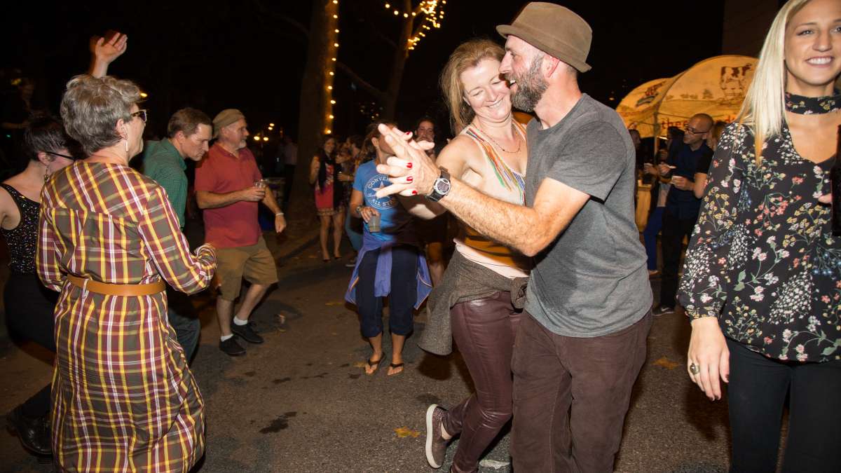 People dance to the music of the West Philadelphia Orchestra at Fairmount Park Conservancy's 5th annual Glow in the Park gathering.