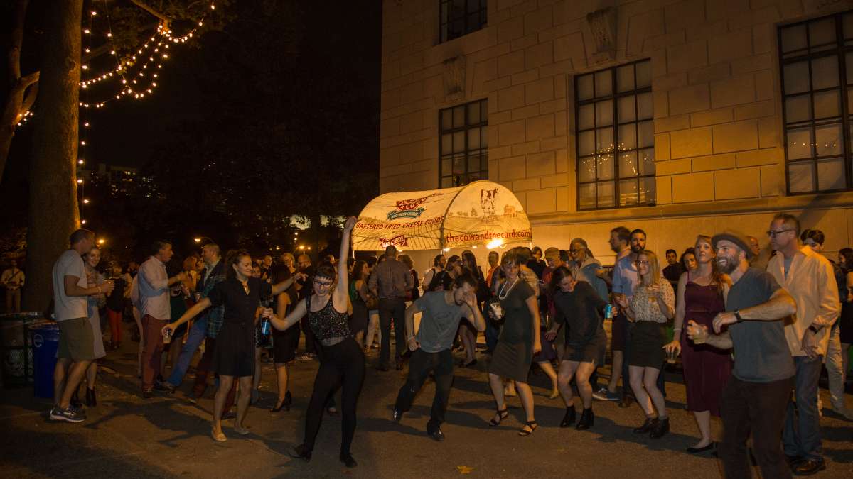 People dance to the music of the West Philadelphia Orchestra at Fairmount Park Conservancy's 5th annual Glow in the Park gathering.