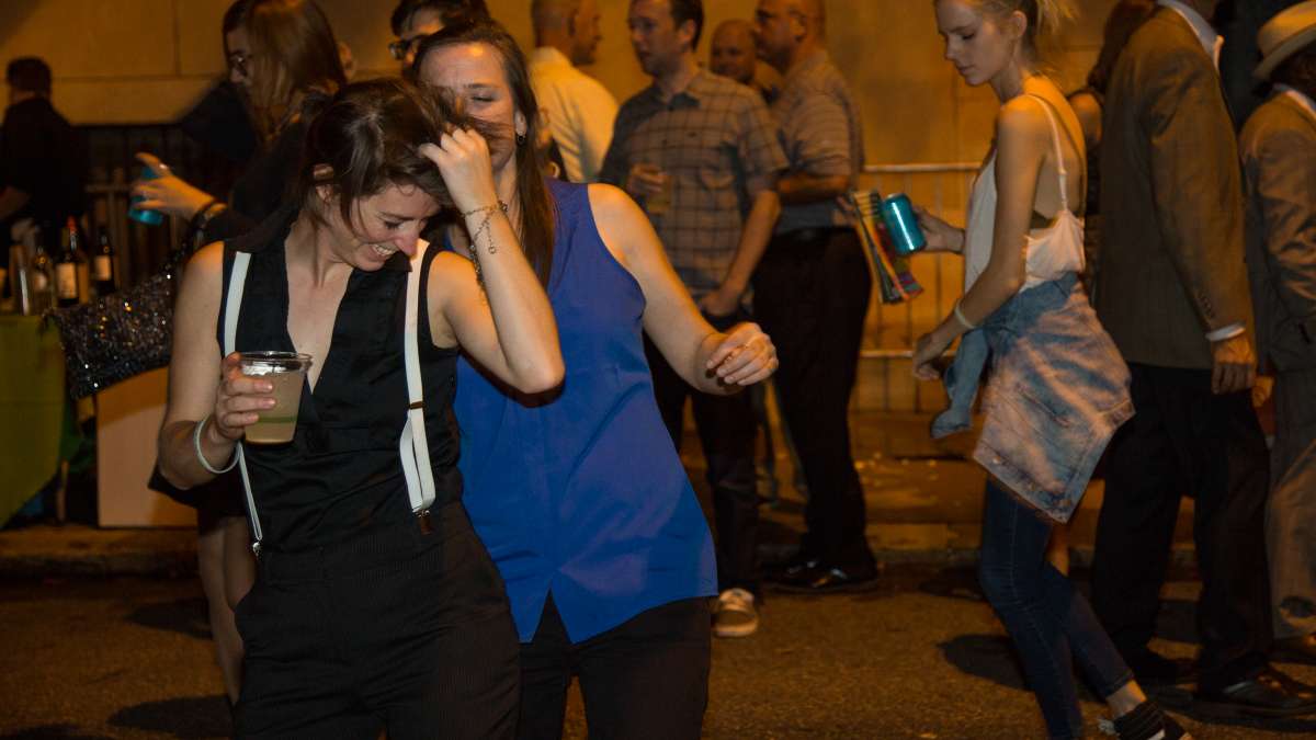 People dance to the music of the West Philadelphia Orchestra at Fairmount Park Conservancy's 5th annual Glow in the Park gathering.