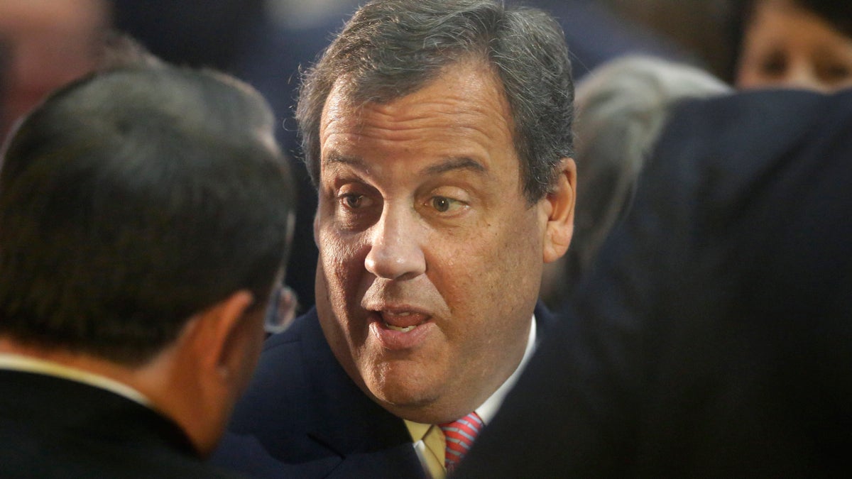  In this 2015 file photo, New Jersey Gov. Chris Christie speaks with people on the floor of the House Chamber of the Statehouse, in Boston, following the inauguration of Massachusetts Republican Gov. Charlie Baker.   With a White House race perhaps in the future, Christie must first do some work at home.   His fifth State of the State address Tuesday, observers say, will serve as a platform to articulate the rationale for his expected 2016 campaign and to help define his tenure as governor on his own terms.  (AP Photo/Steven Senne, File) 