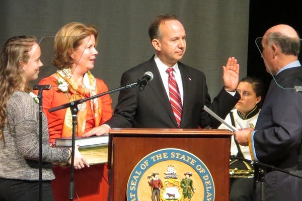 <p><p>Delaware Governor Jack Markell takes the oath of office beside his wife and daughter. (Kim Phan/for NewsWorks)</p></p>

