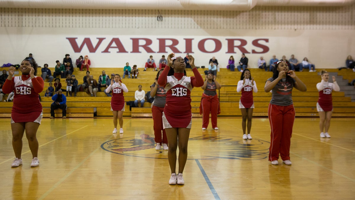  East High cheerleaders perform at halftime during a high school basketball game between the East Warriors and the General McLane Lancers in Erie, Pennsylvania. (Lindsay Lazarski/WHYY) 