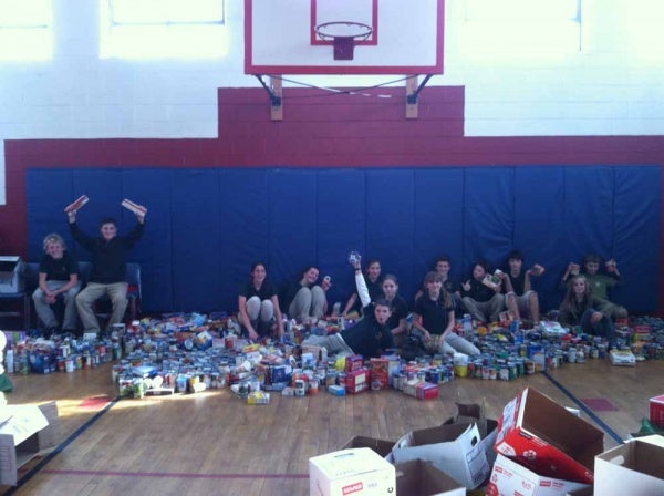 <p><p>The Student Leadership team poses with the 2,316 items collected for North Light Community Center's food cupboard. (Photo courtesy of Steve Masterson)</p></p>
