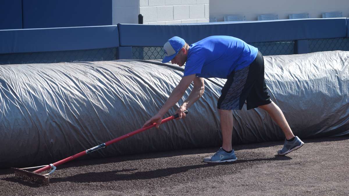 Pennsylvania College of Technology baseball player Nick Perna trains as part of the grounds crew for the inaugural MLB Little League Classic on Sunday in Williamsport, Pennsylvania. (Matt Blymier)