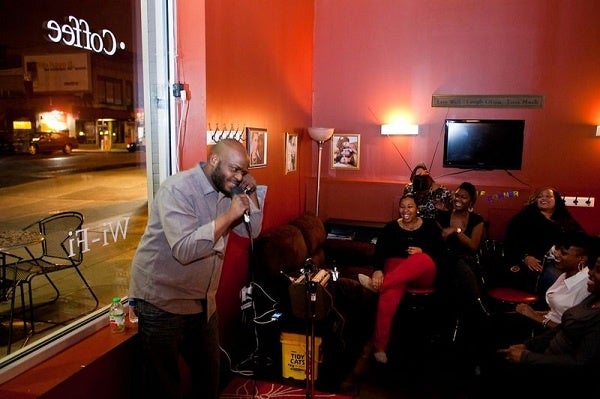 <p><p>Lamont Maxx performs at the Wired Beans Cafe comedy night. (Brad Larrison/for NewsWorks)</p></p>
