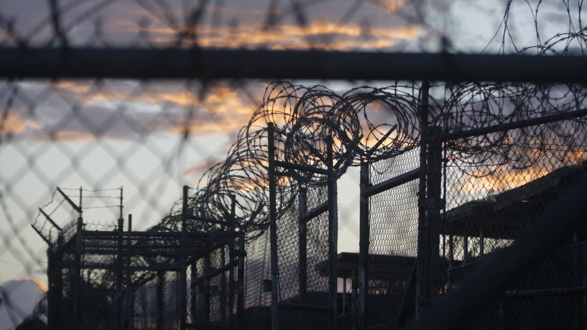  In this Nov. 21, 2013, file photo, dawn arrives at the now closed Camp X-Ray, which was used as the first detention facility for al-Qaida and Taliban militants who were captured after the Sept. 11 attacks. (AP Photo/Charles Dharapak, File) 