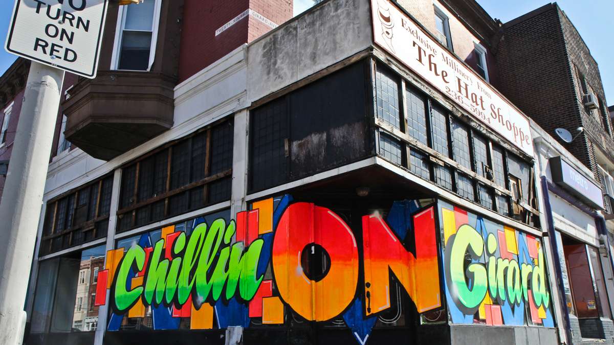 Artist Stephen Powers and developer David Waxman are changing the landscape of Girard Avenue one hand-painted sign at a time. (Kimberly Paynter/WHYY)