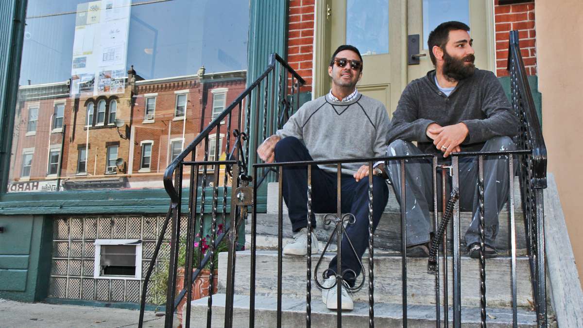 Co-manager David Waxman of MM Partners and Jeb Woody, CEO of Shifty's Taco on the development company's stoop in Brewerytown. (Kimberly Paynter/WHYY)