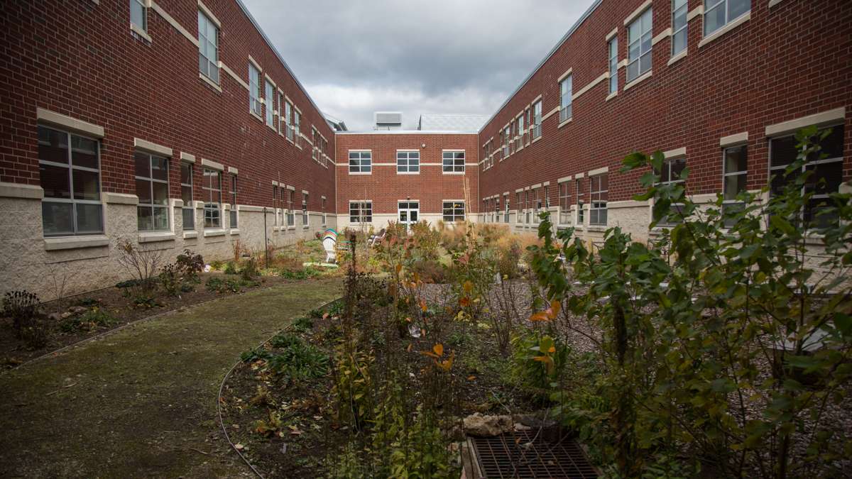 The campus at Upper Dublin High School has three seperate courtyards. This one is tended by students and has outdoor seating for an outdoor learning option. (Emily Cohen for NewsWorks)