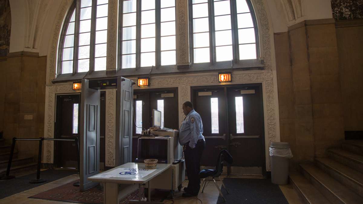 A metal detector and an x-ray machine sit at the enterance of Overbrook High School. (Emily Cohen for NewsWorks)