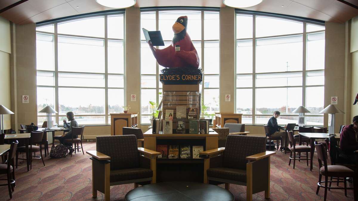 The library at Upper Dublin High School was reimagined as a media center during the rebuild of the campus. The room is broken up into three parts, books, computers space, and tables for studying. (Emily Cohen for NewsWorks)