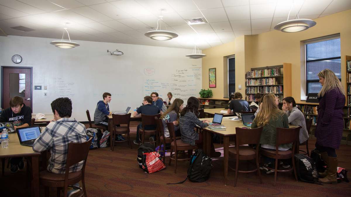 The library at Upper Dublin High School was reimagined as a media center during the rebuild of the campus. The room is broken up into three parts, books, computers space, and tables for studying. (Emily Cohen for NewsWorks)
