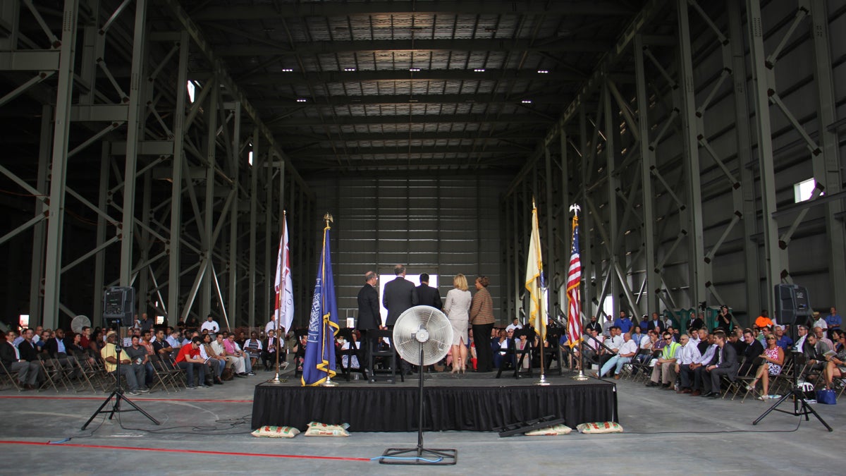  Government officials attend a ceremony for the raising of the final steel beam at Holtec International. The company got $260 million in tax incentives to build its manufacturing plant in Camden. (Emma Lee/WHYY) 