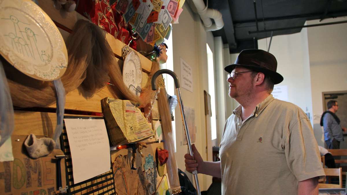 Tom Nance, a client of Coordinated Homeless Outreach Center, admires the work he helped to create. (Emma Lee/WHYY)